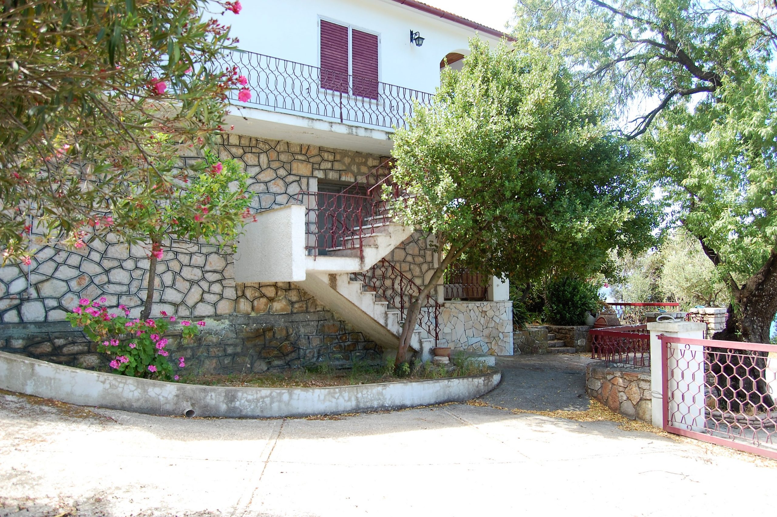 Side view of house for sale in Ithaca Greece Lefki