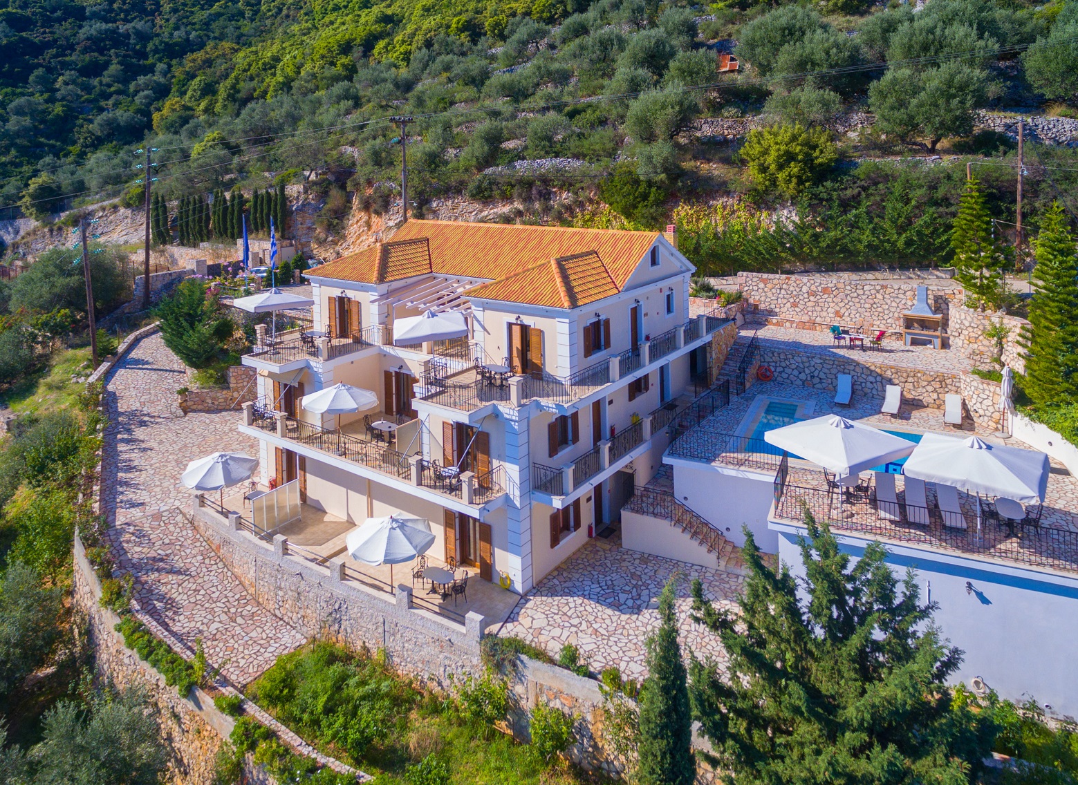 Aerial view of apartment complex with pool for sale in Ithaca Greece Vathi