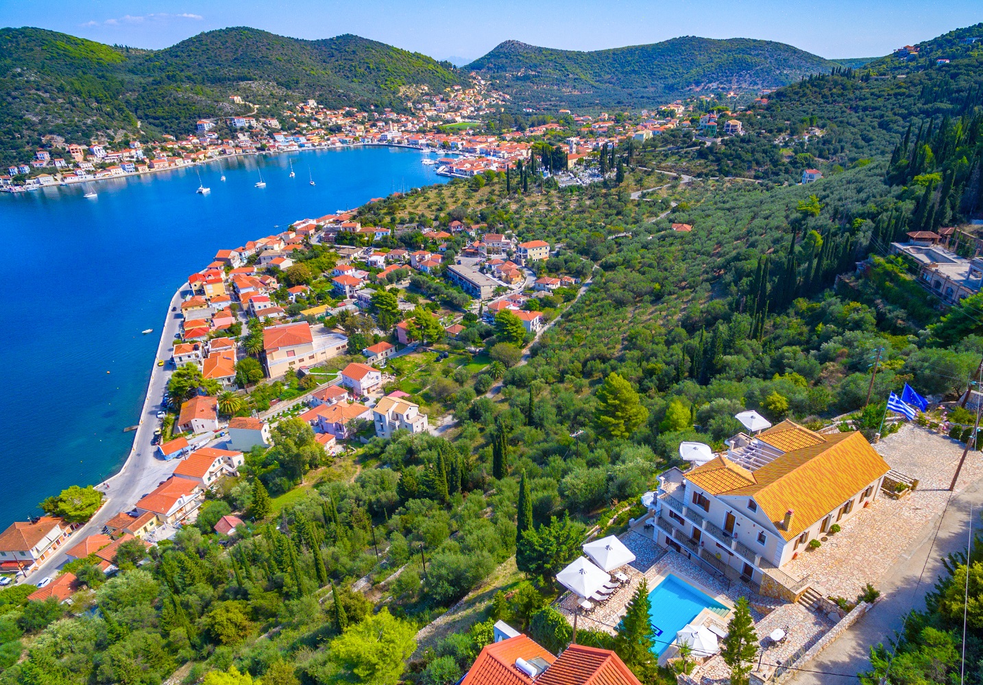 Aerial view of apartment complex with pool for sale in Ithaca Greece Vathi