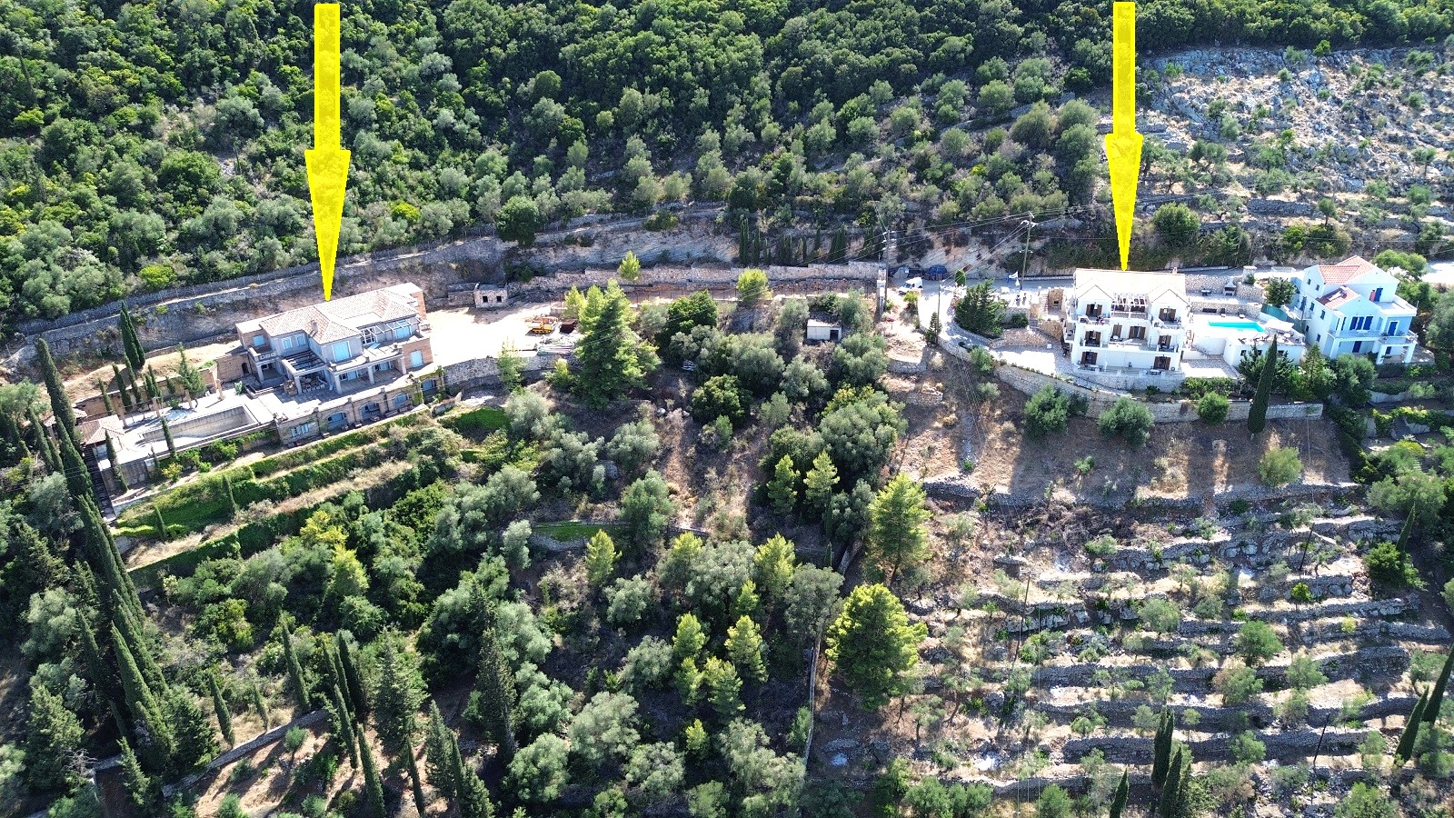 Aerial view of two adjacent properties a boutique hotel and an apartment complex for sale in Ithaca Greece Vathi