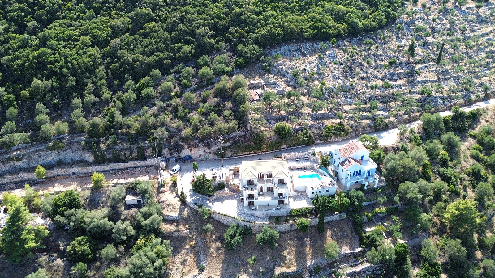 Aerial view of apartment complex with pool for sale in Ithaca Greece Vathi