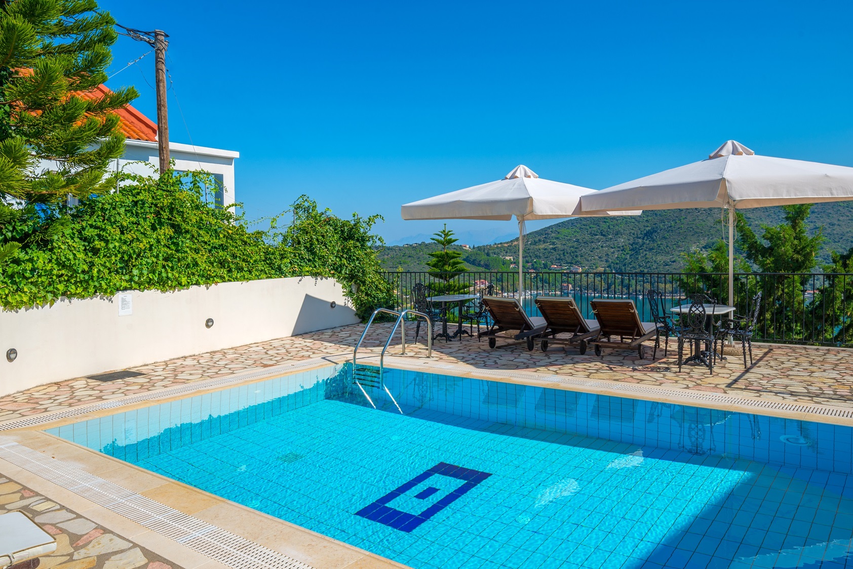 Pool area of apartment complex for sale in Ithaca Greece Vathi