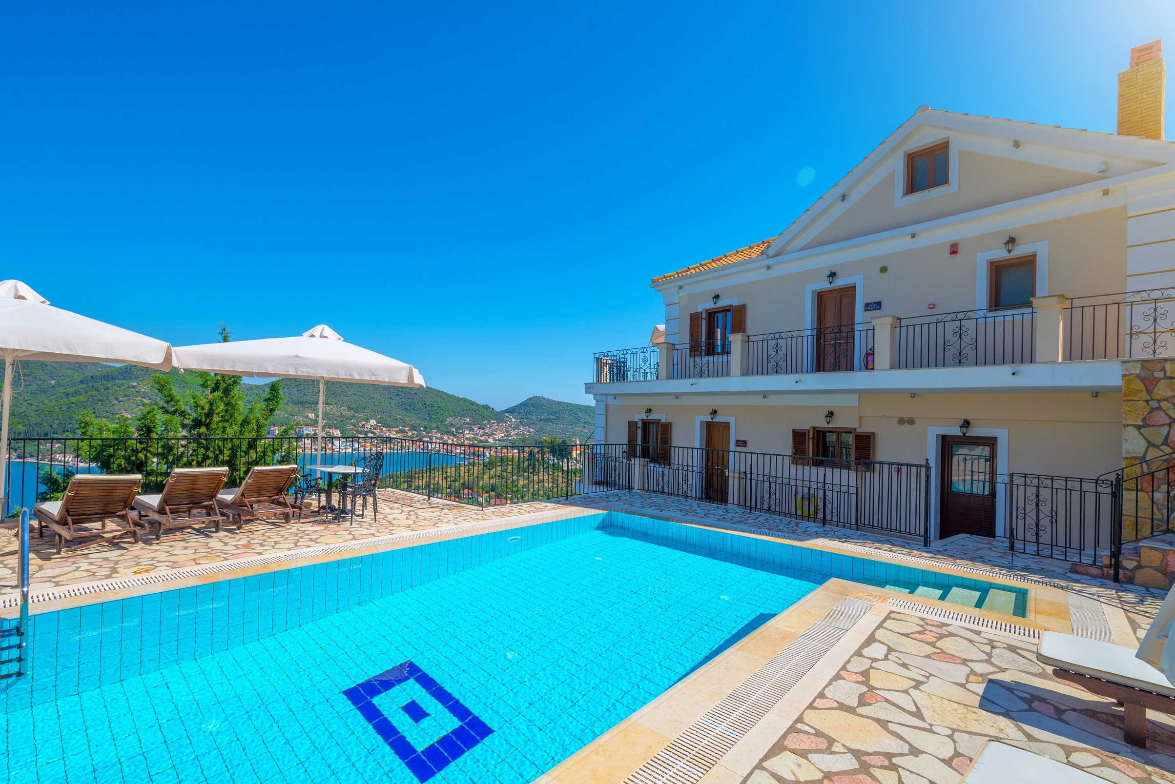 Pool and outside space of apartment complex for sale in Ithaca Greece Vathi