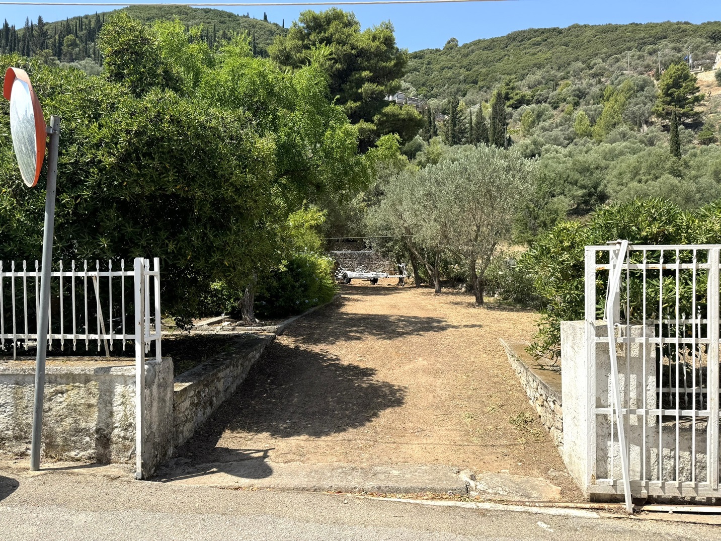 Front gate of house with garden for sale in Ithaca Greece Vathi