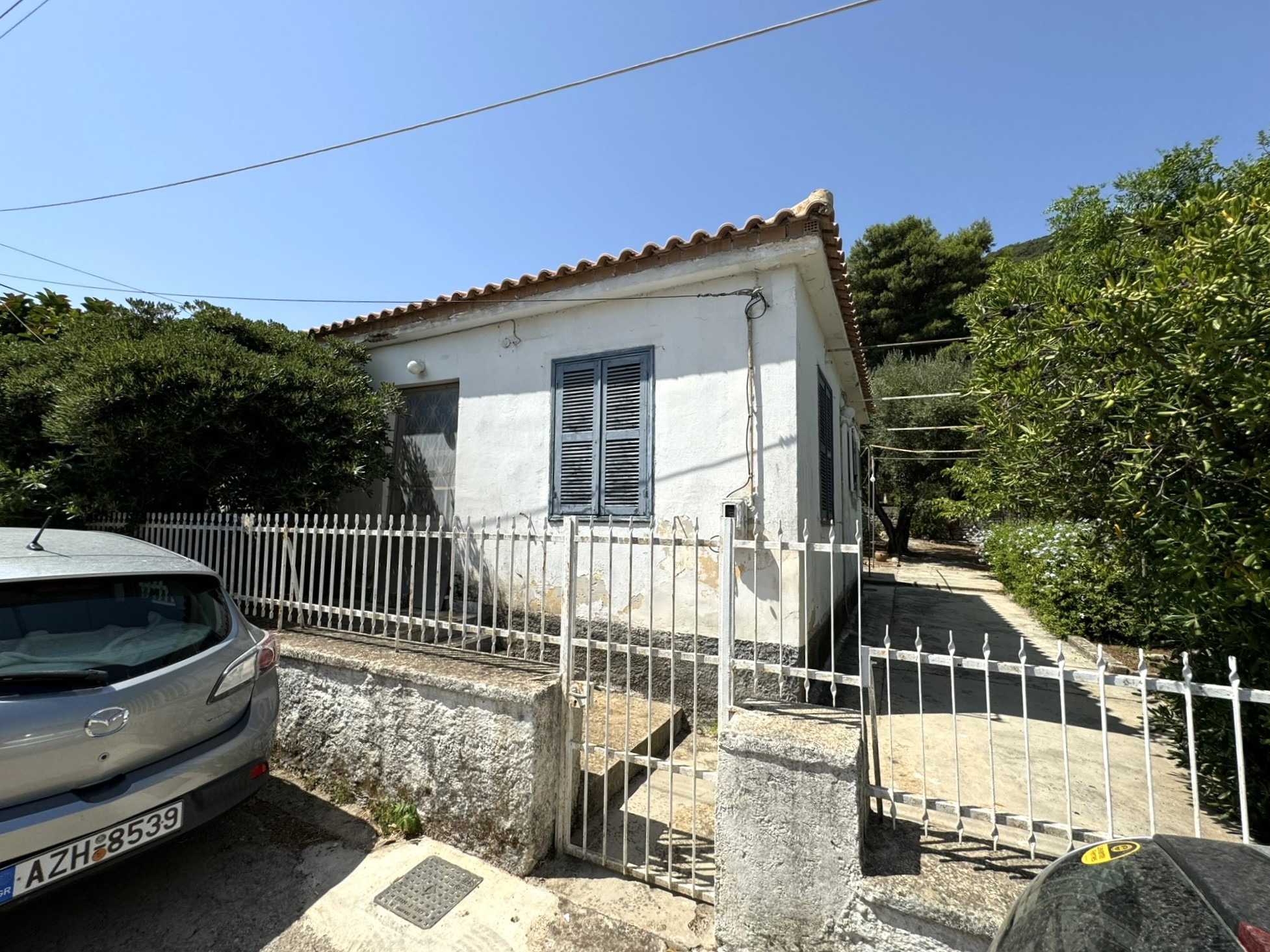 Road view of house for sale in Ithaca Greece Vathi