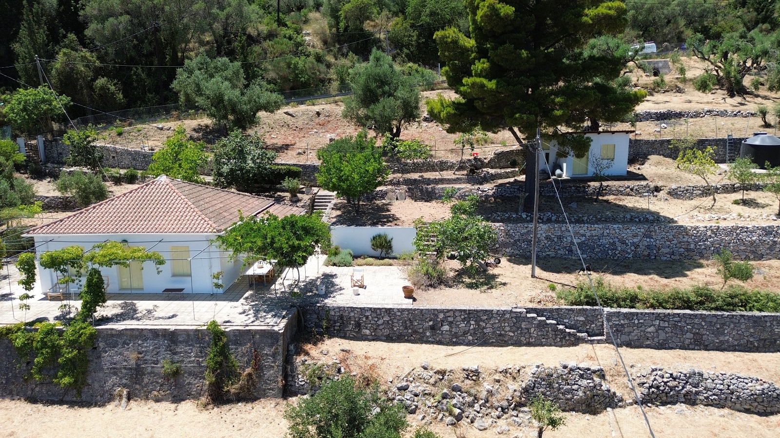 Aerial views of house with detached guesthouse for sale in Ithaca Greece Platrithya