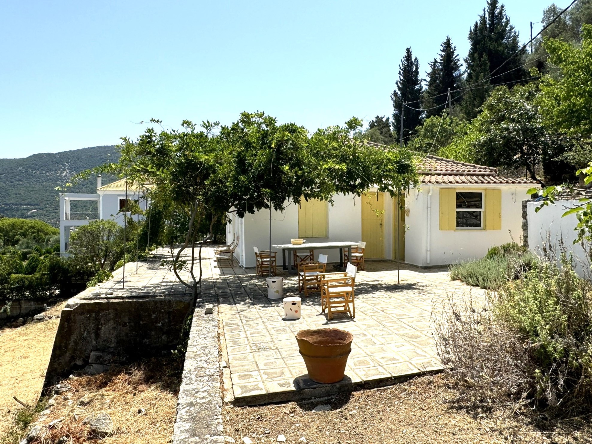 Patio and exterior of house for sale in Ithaca Greece Platrithya