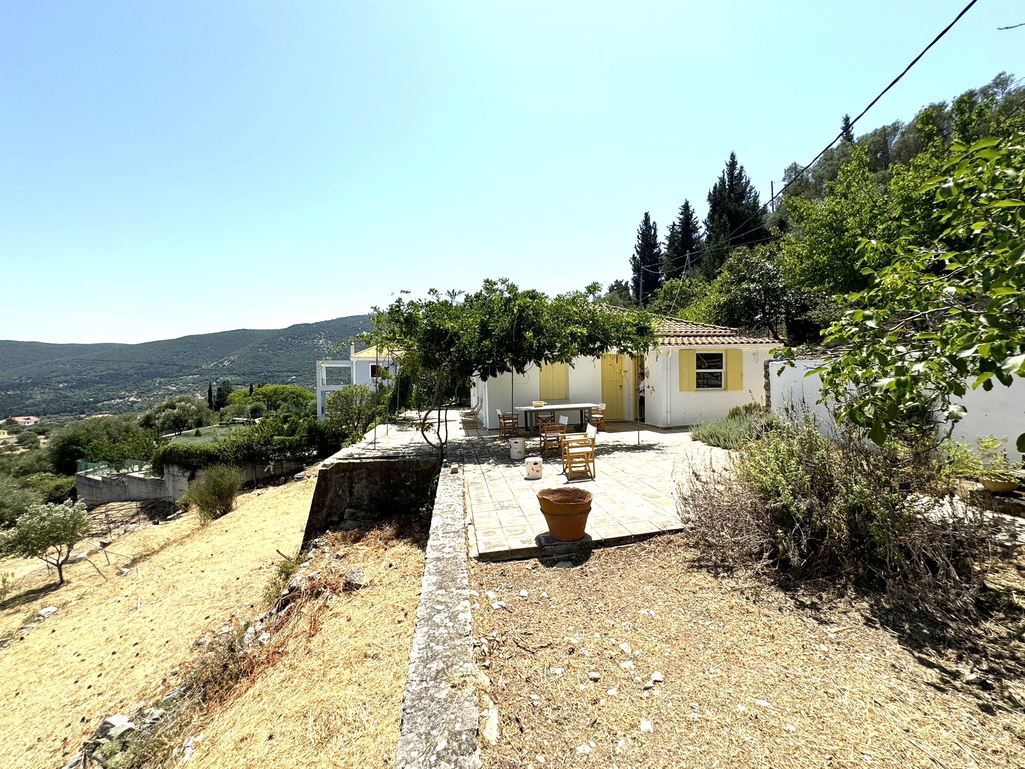 Patio and exterior of house for sale in Ithaca Greece Platrithya