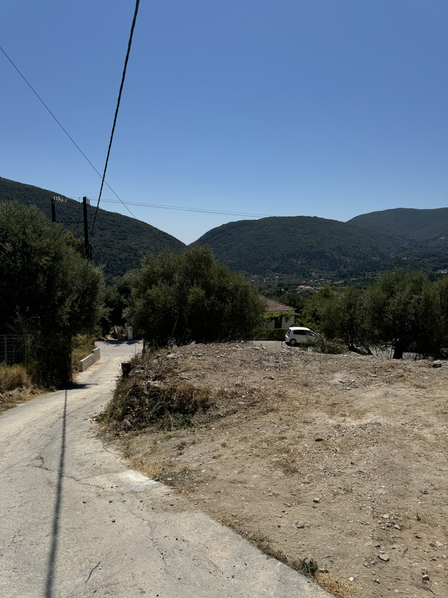 Road view of land for sale in Ithaca Greece Platrithya