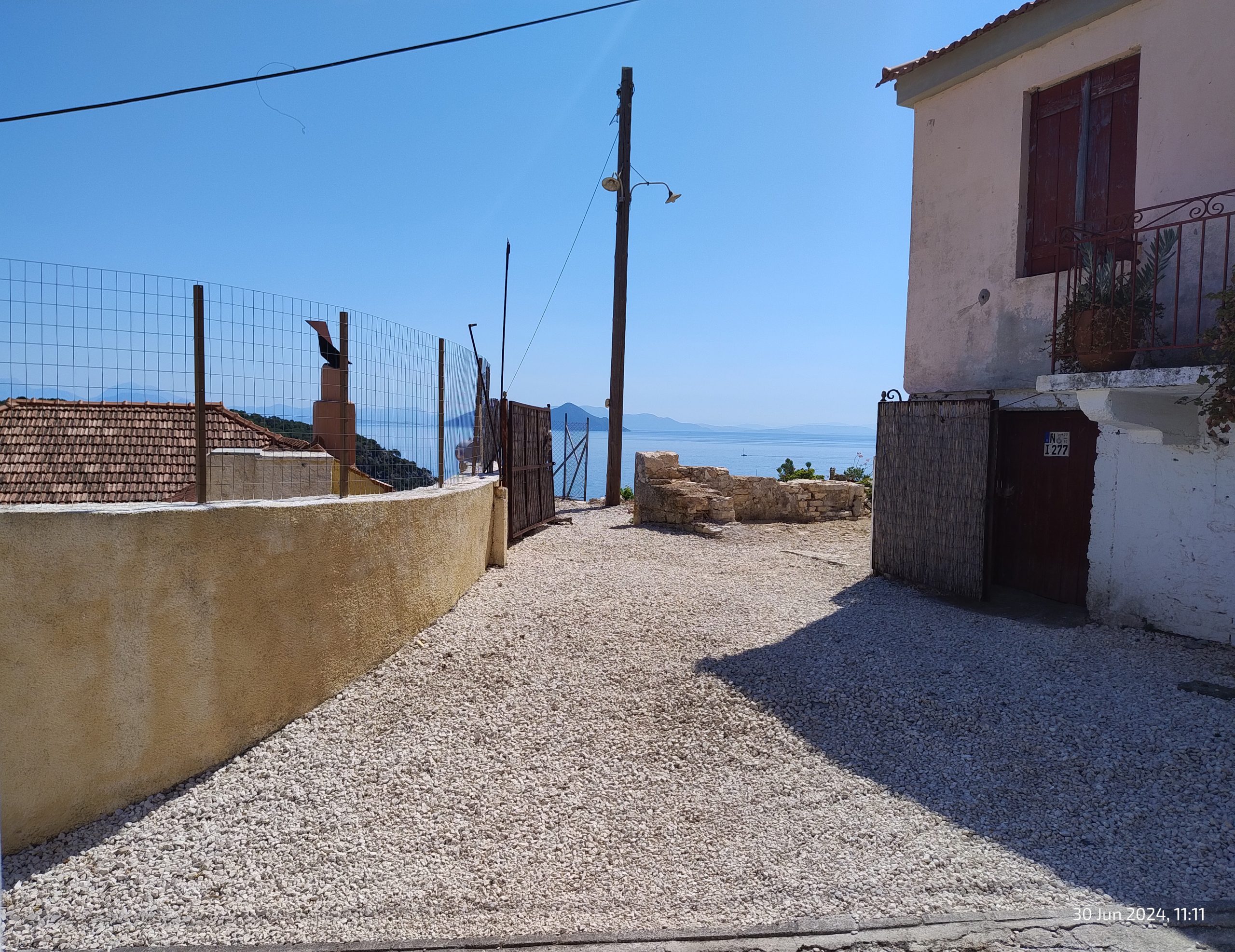 Access road to land with building license for sale in Ithaca Greece Kioni