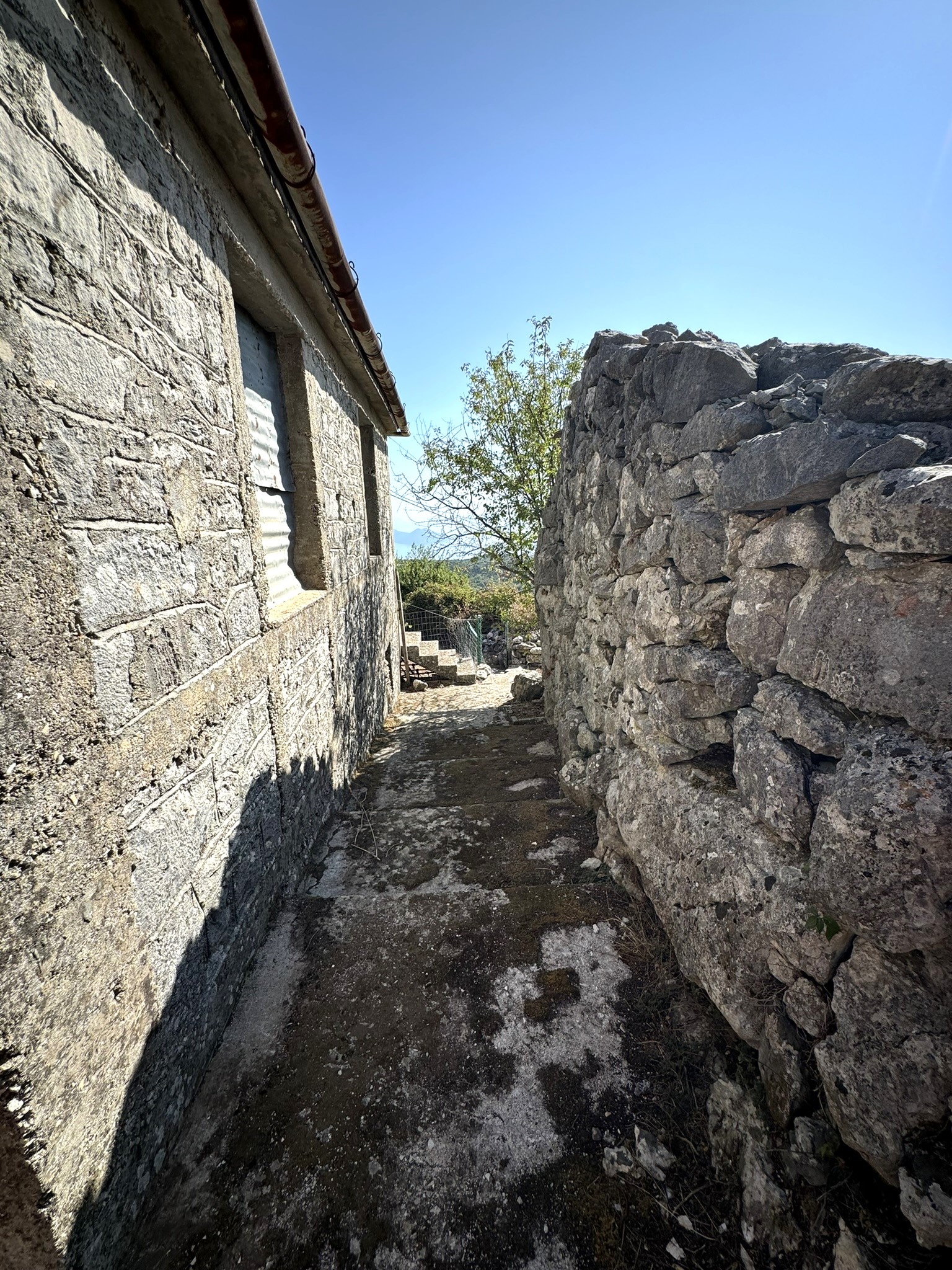 Back view of house for sale in Ithaca Greece Anoghi