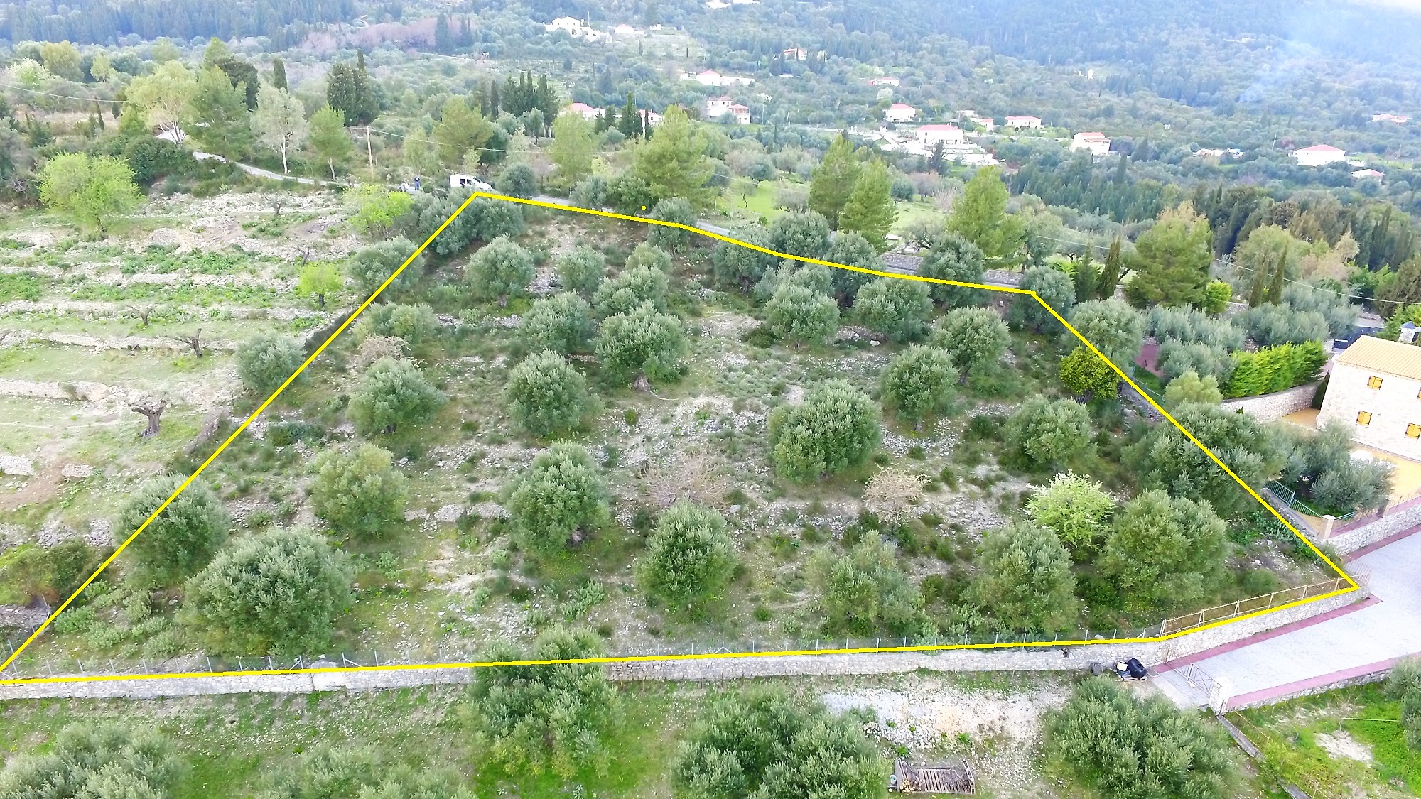 Aerial view and border of land with building license for sale in Ithaca Greece Pilikata