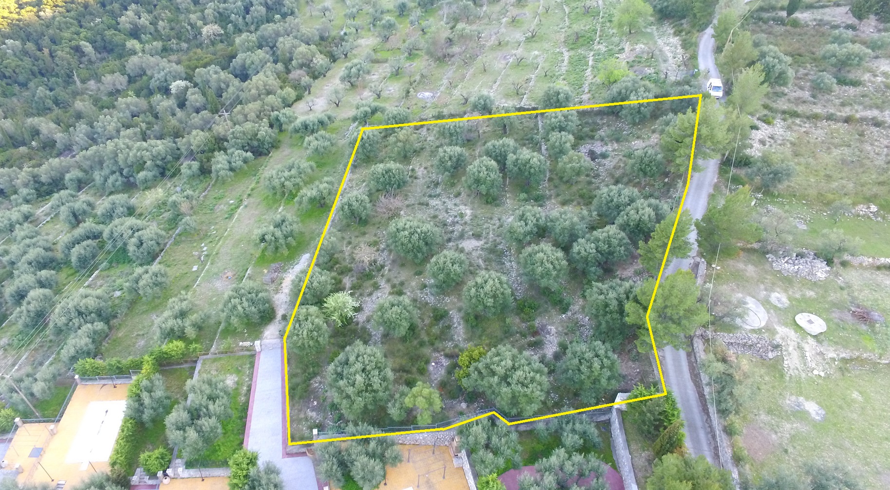 Aerial view and border of land with building license for sale in Ithaca Greece Pilikata