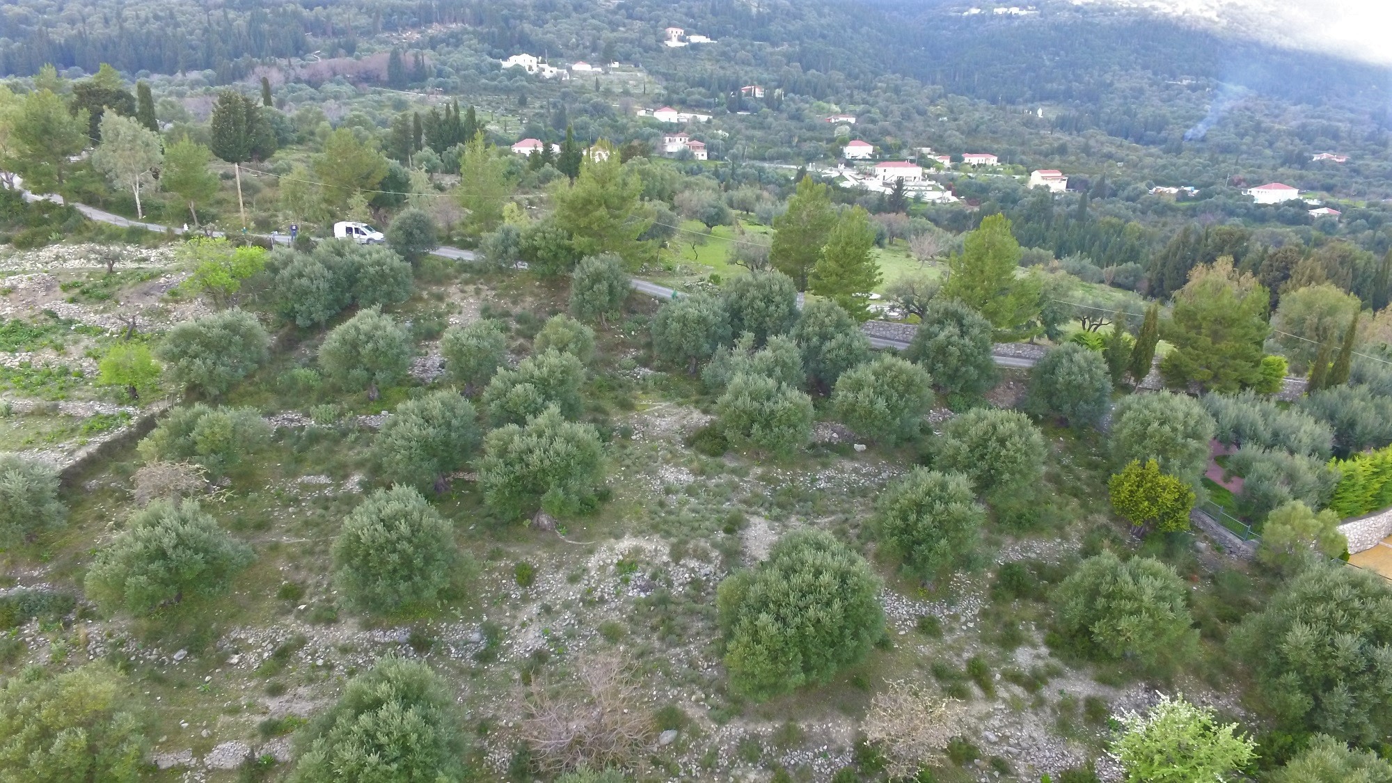 Aerial views of land with building license for sale in Ithaca Greece Pilikata
