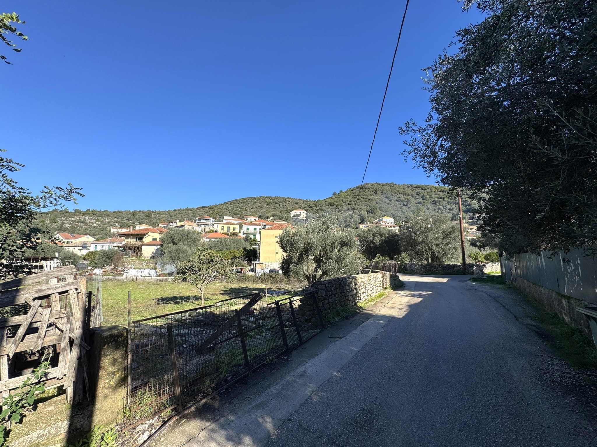 Road view of land for sale in Ithaca Greece, Vathi