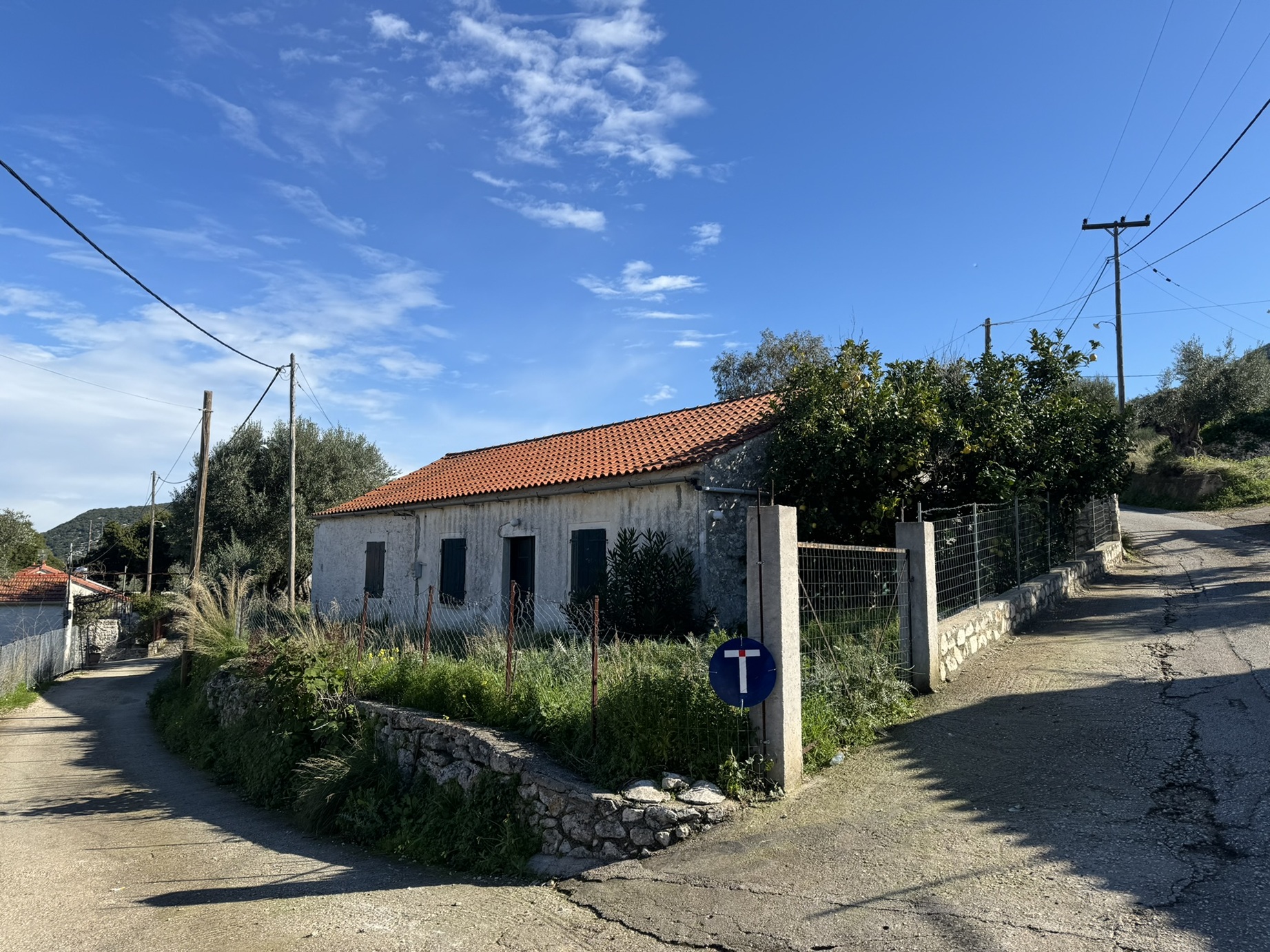 Road view of house for sale in Ithaca Greece, Stavros