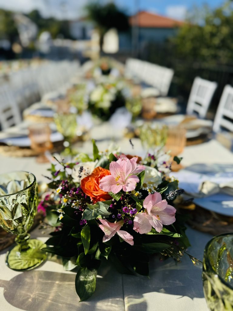 Flower detail on tables at wedding reception in Ithaca Greece, Anoghi