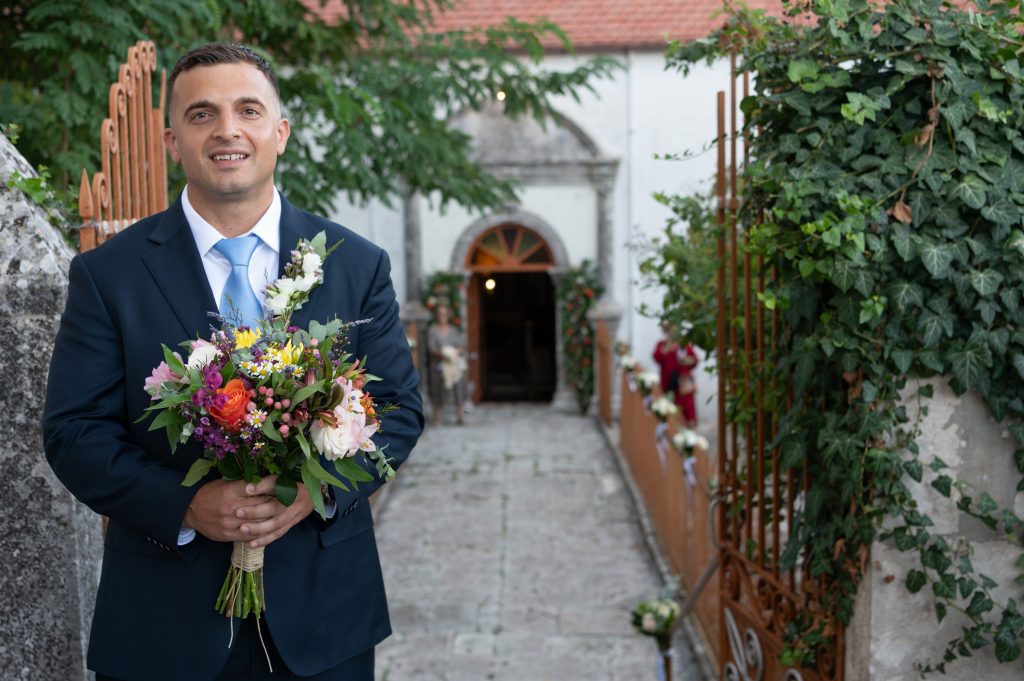 Groom at church for wedding in Ithaca Greece, Anoghi