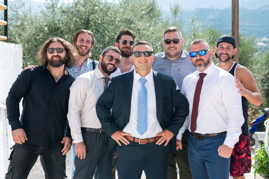 Groom with friends at wedding in Ithaca Greece, Anoghi