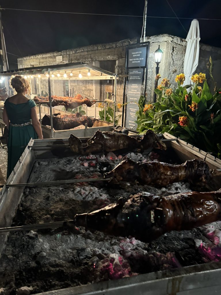 Piglet on the spit at wedding reception in Ithaca Greece, Anoghi