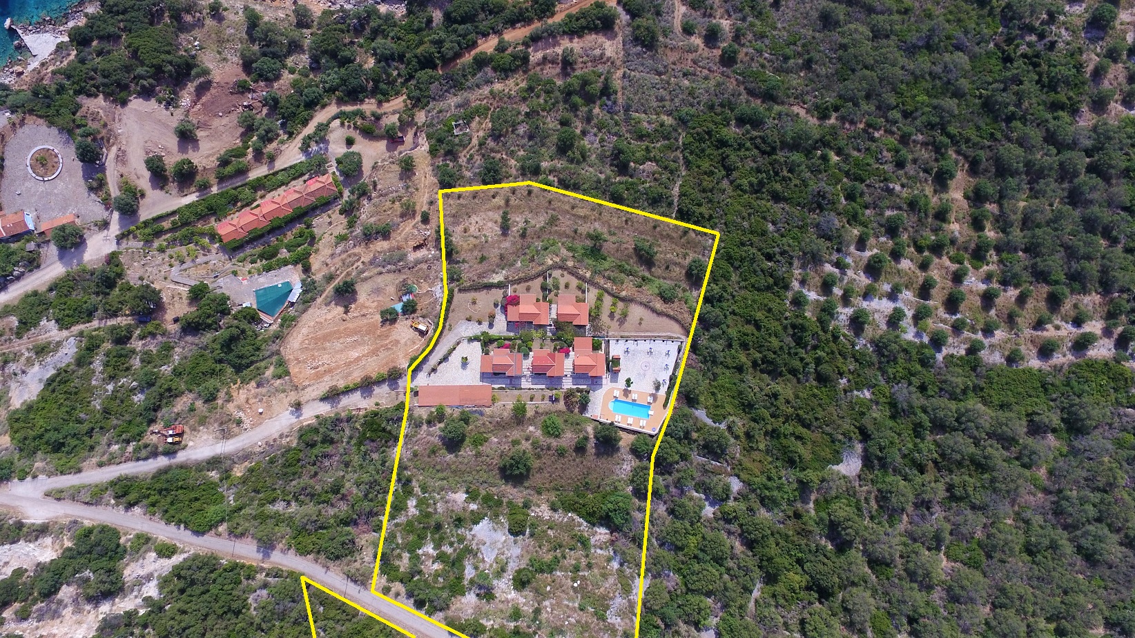 Aerial view with outlined border of cottages for sale in Ithaca Greece, Stavros