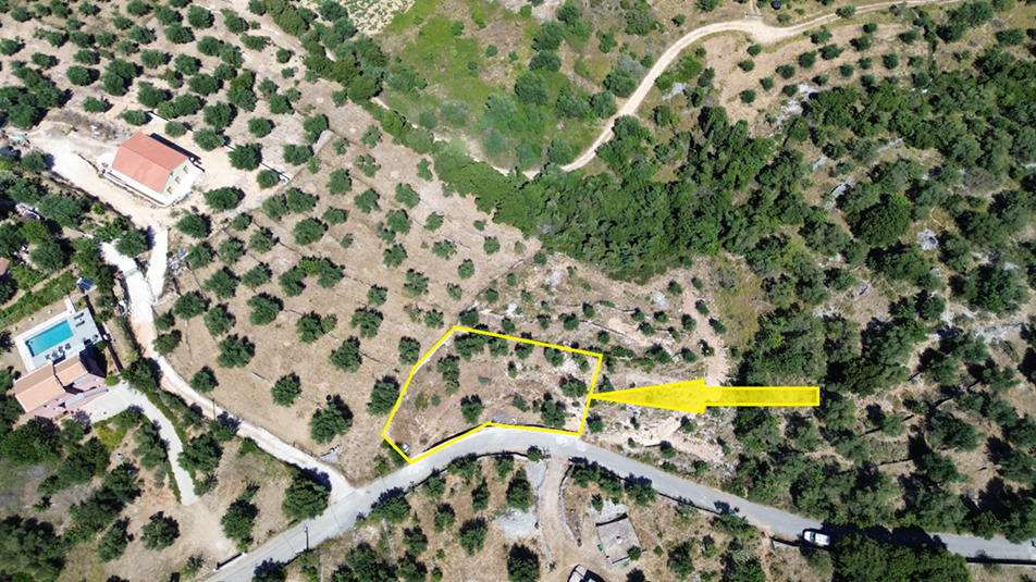 Aerial view with border of land with building license for sale in Ithaca Greece, Vathi