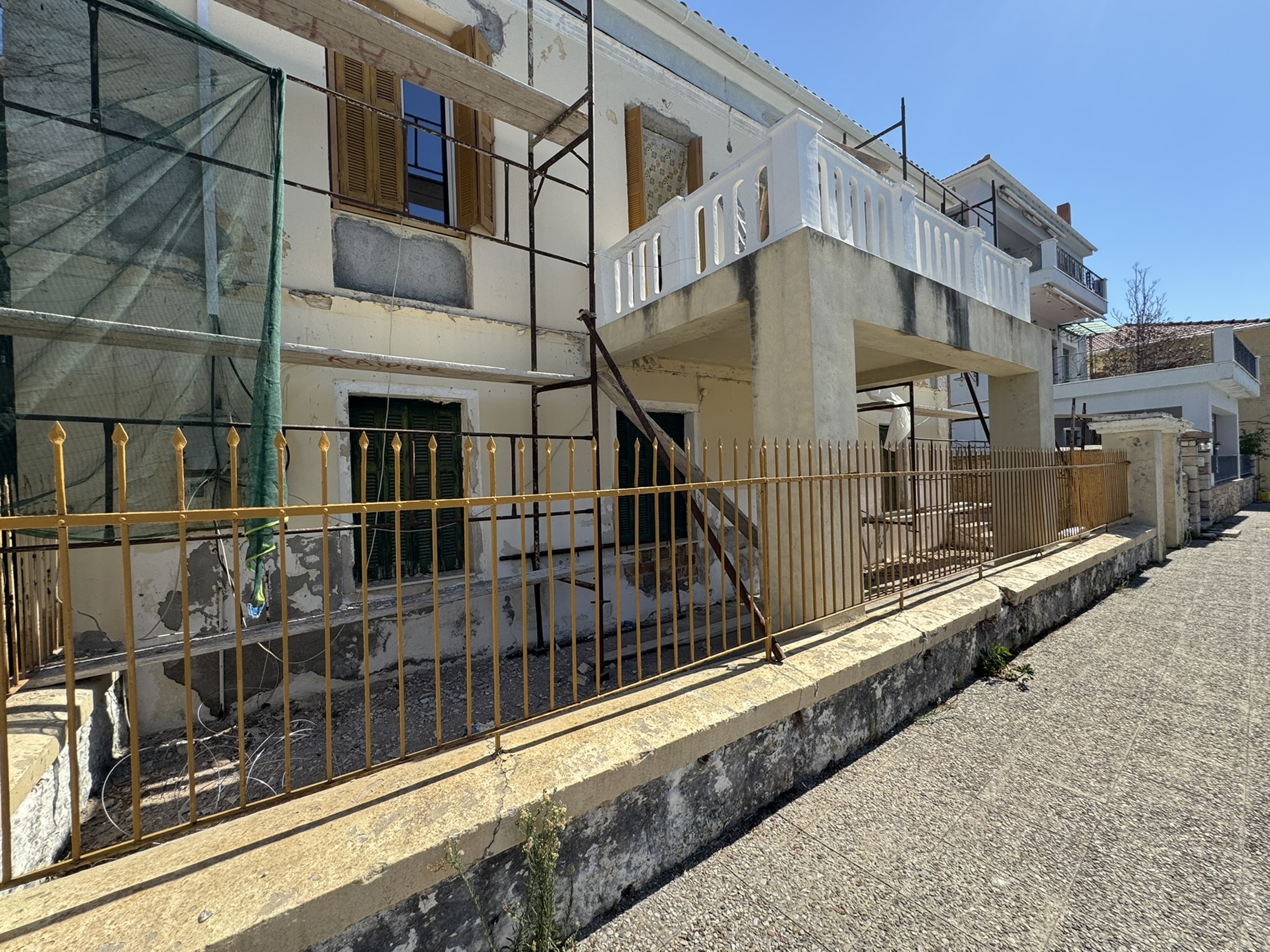 Road view of house for sale in Ithaca Greece, Vathi