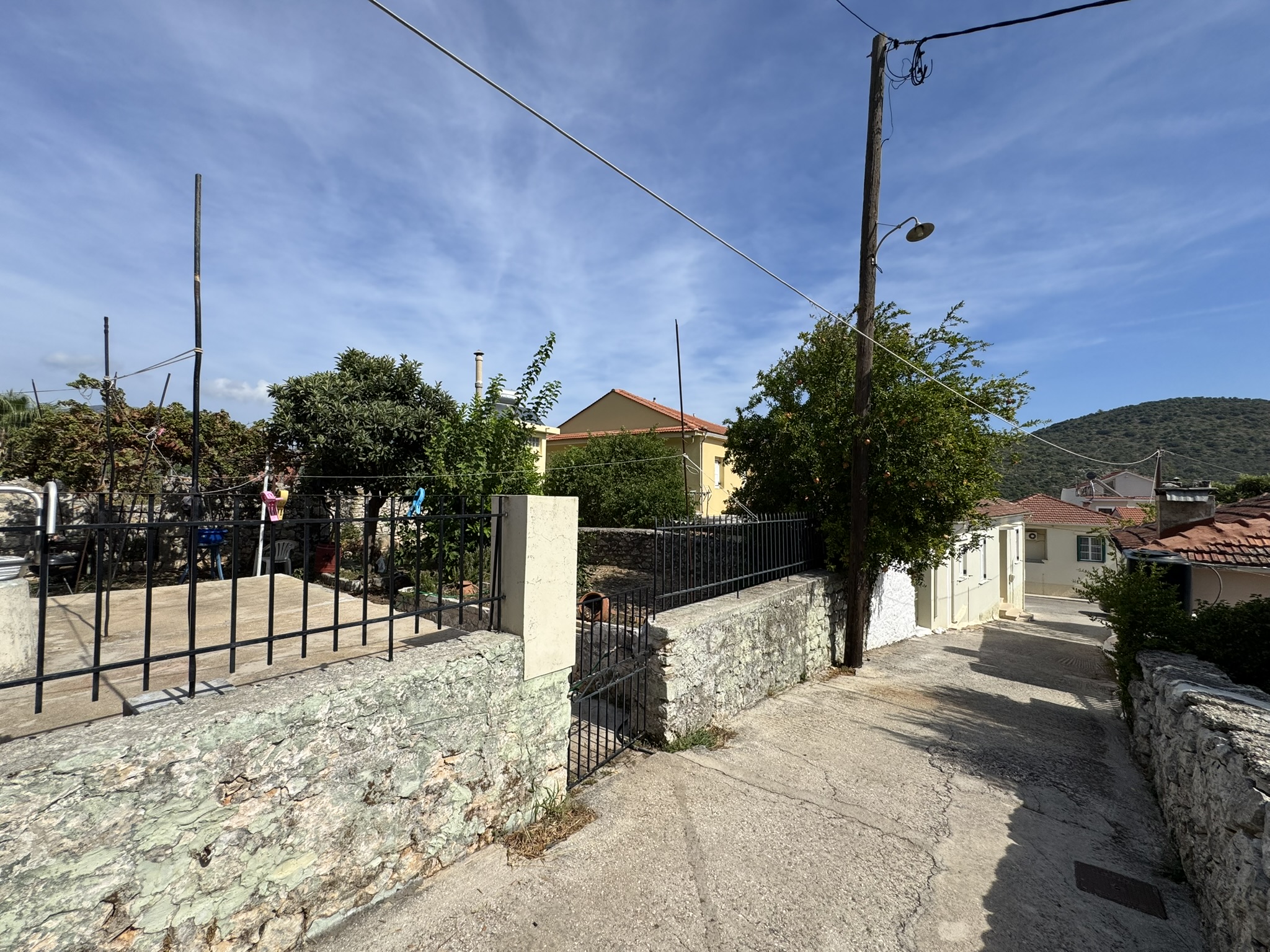 Road view of house for sale in Ithaca Greece, Vathi