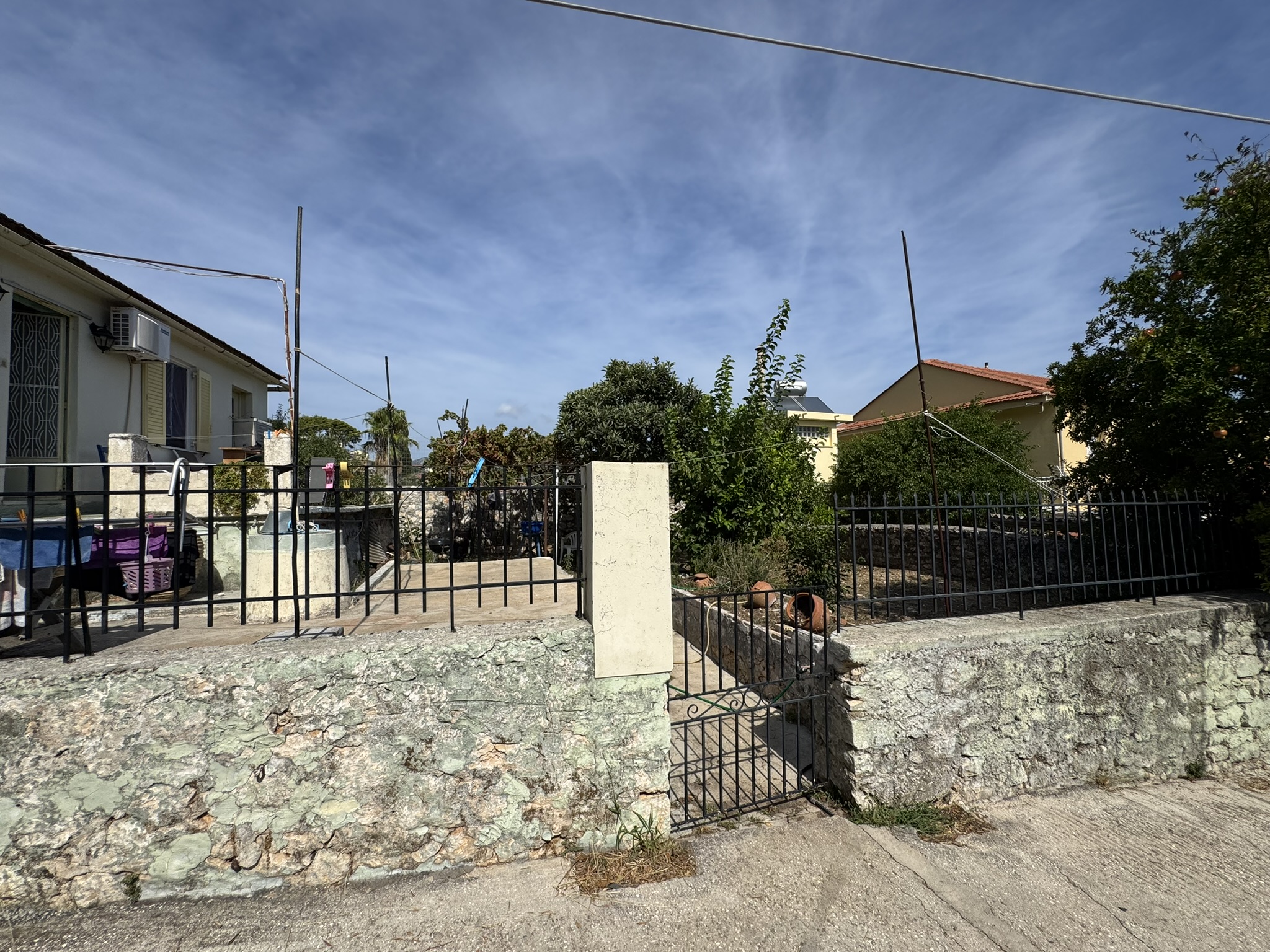 Road view of house for sale in Ithaca Greece, Vathi