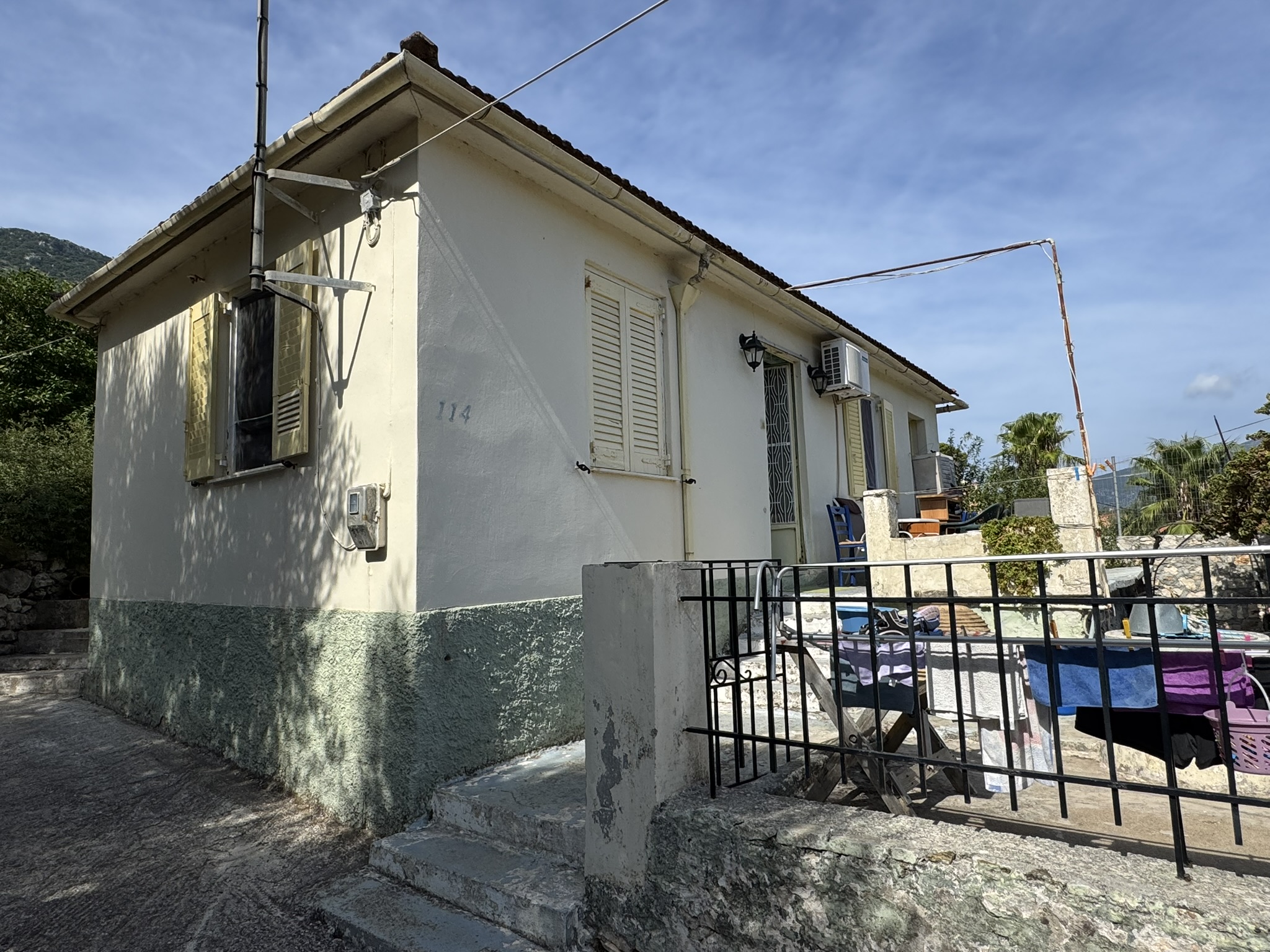 Road view of house for sale in Ithaca Greece, Vathi