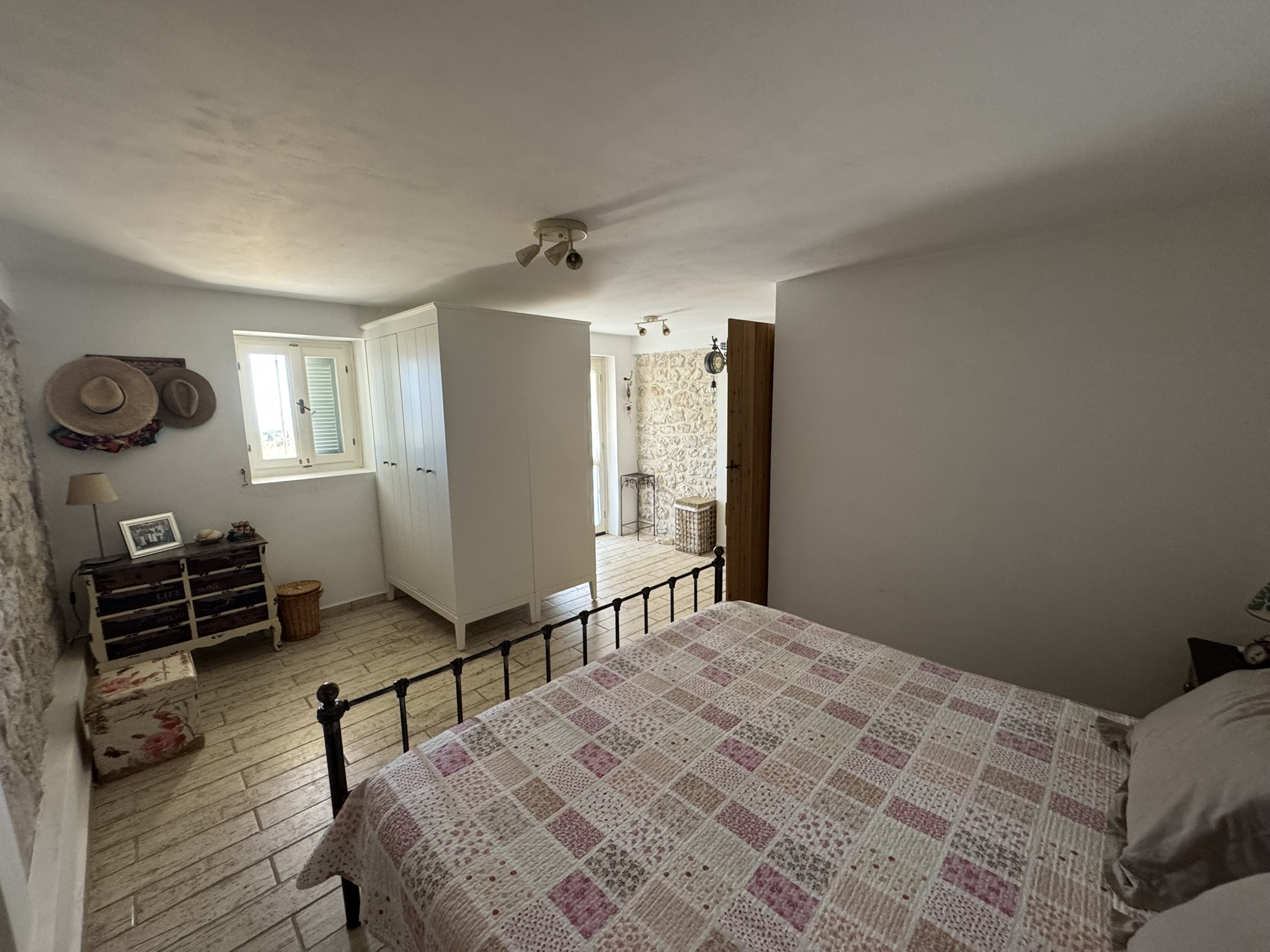 Double bedroom with en suite bathroom of house for sale in Ithaca Greece, Anoghi
