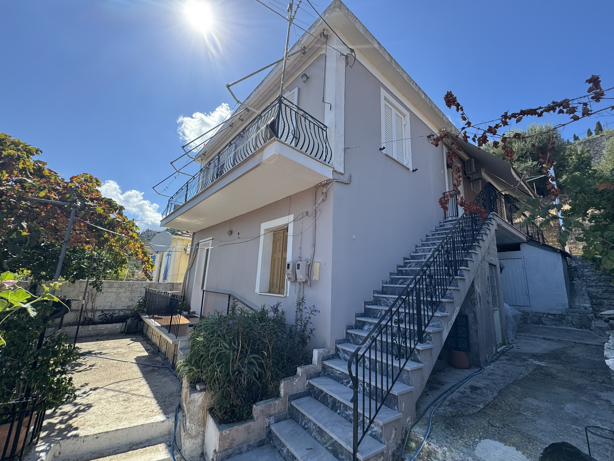 Road view of house for sale in Ithaca Greece, Vathi