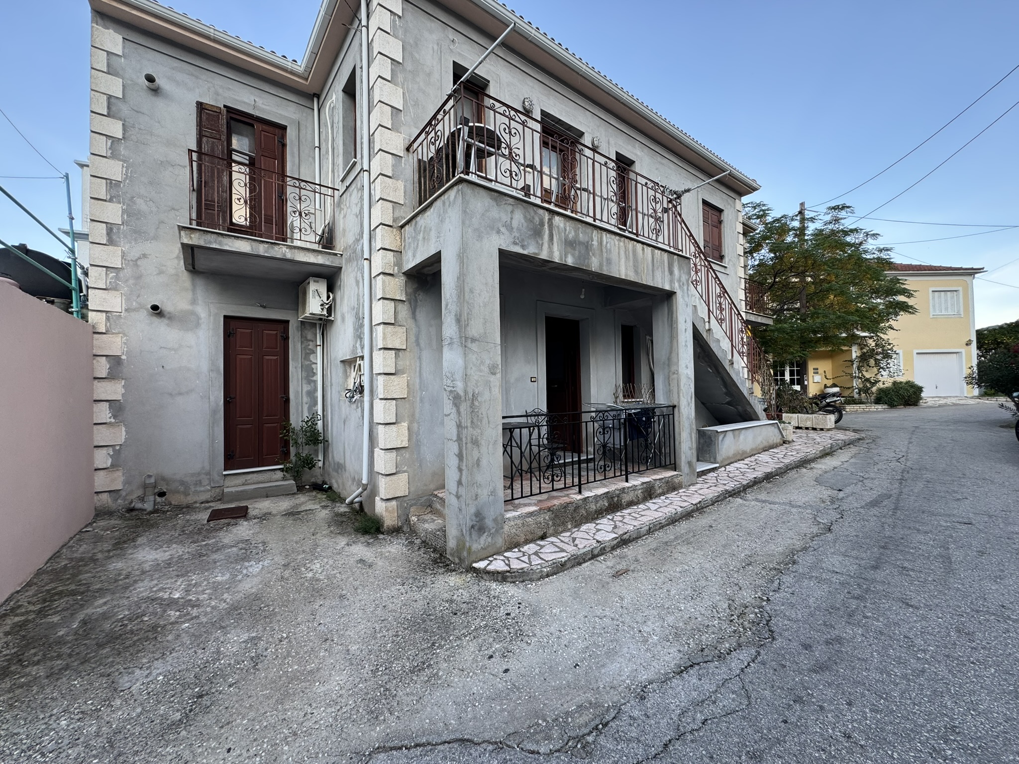 Road view of house for sale in Ithaca Greece, Vathi