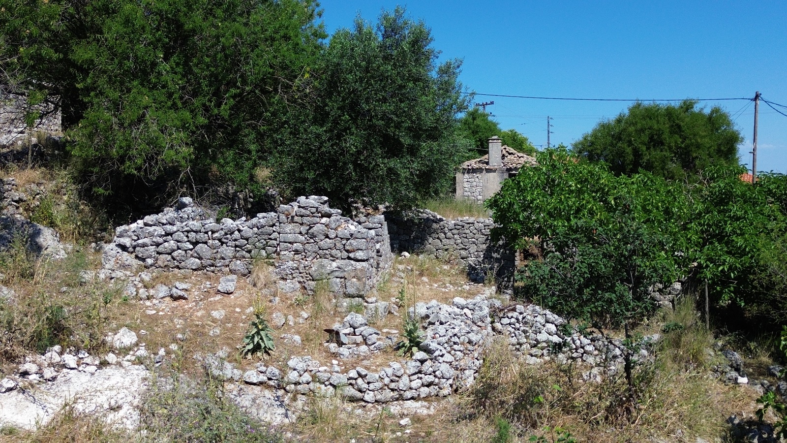 Aerial view of land with ruin for sale in Ithaca Greece, Anoghi