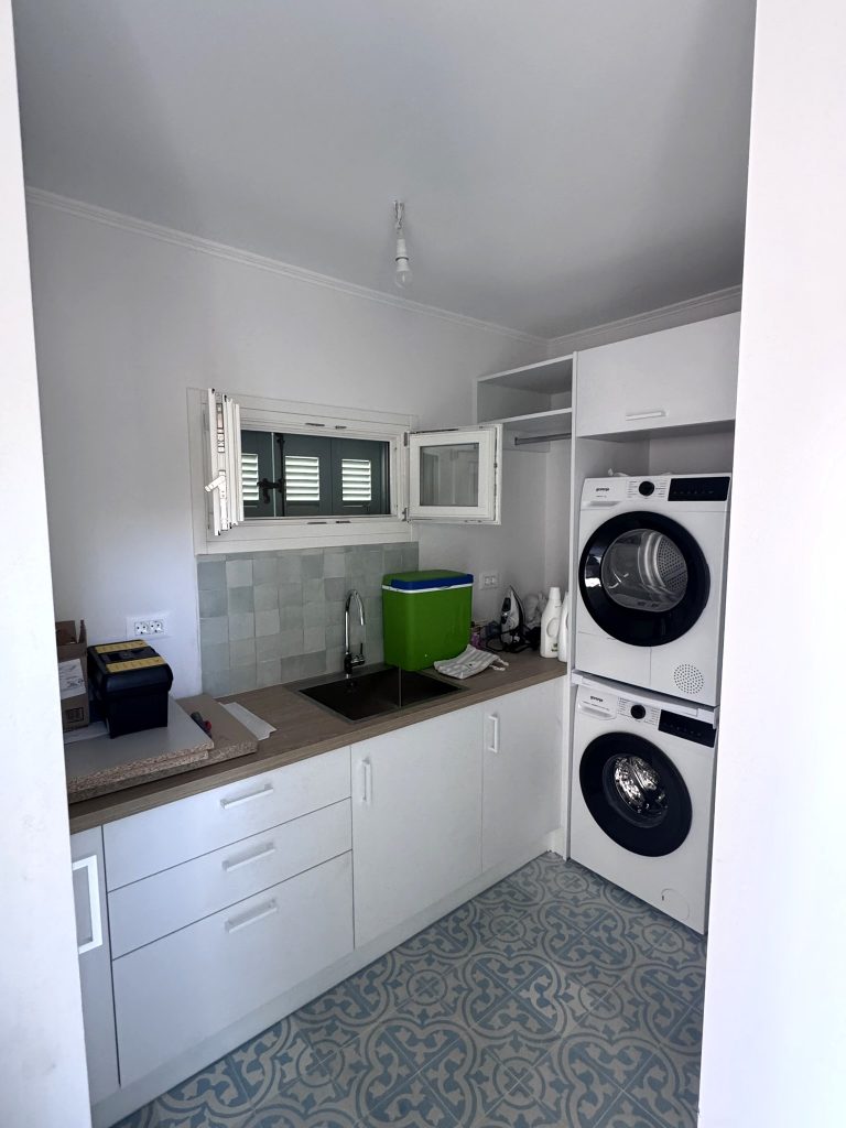 Laundry room of house renovated with project management in Ithaca Greece Vathi