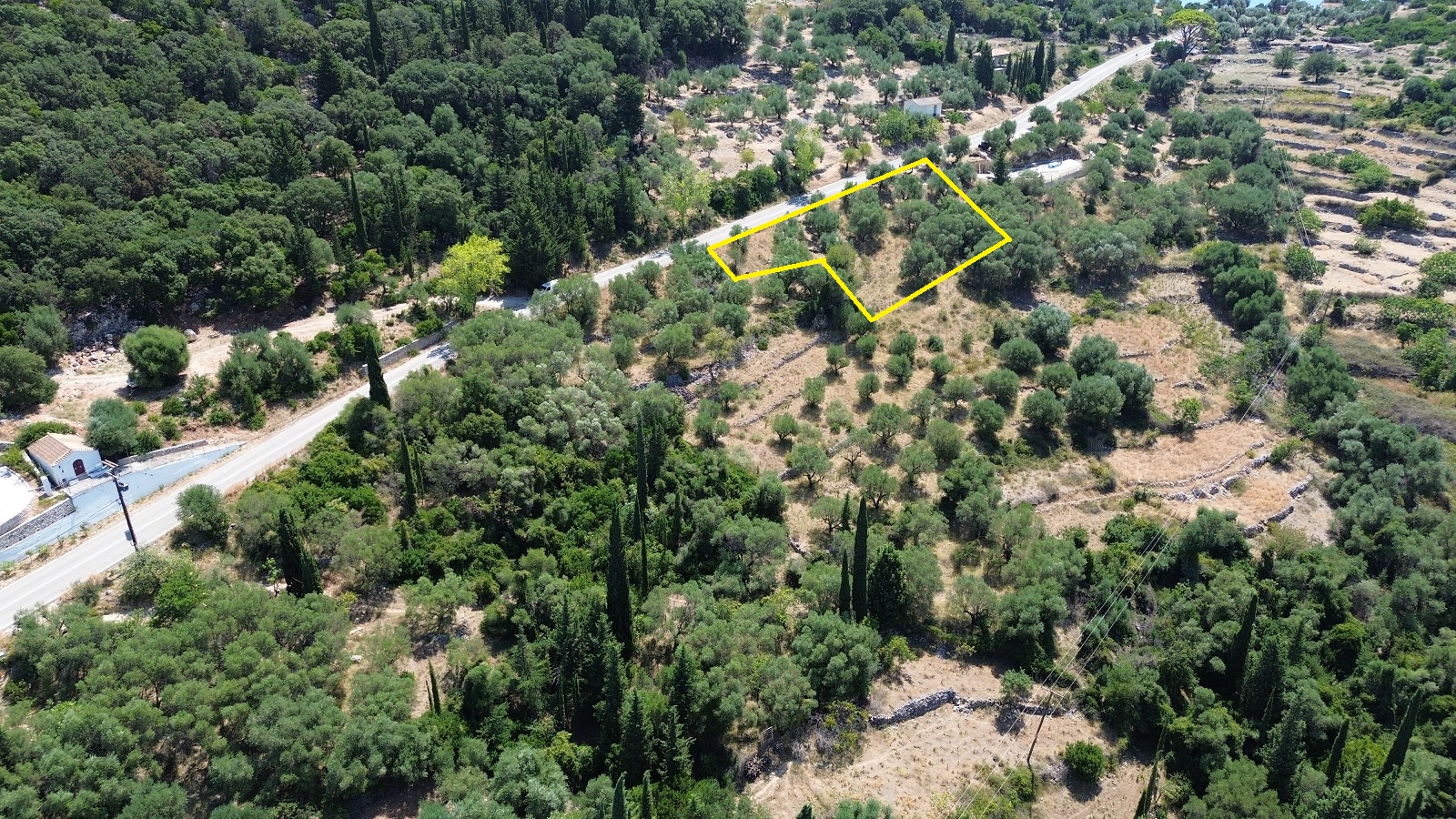 Aerial view with outlined border of land with building license for sale in Ithaca Greece Piso Aetos