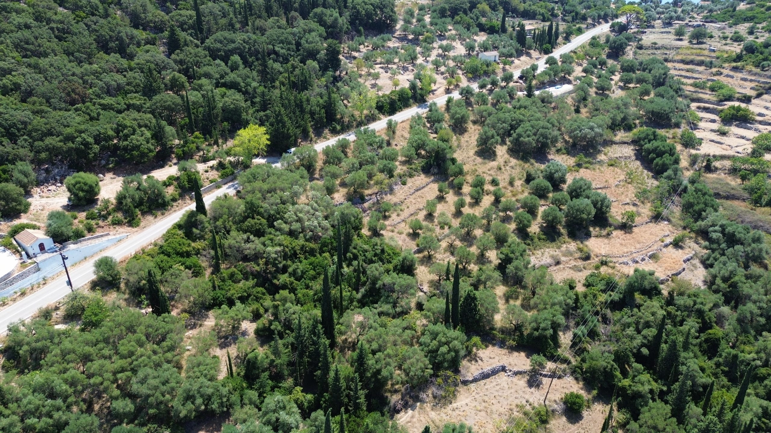 Aerial view of land with building license for sale in Ithaca Greece Piso Aetos