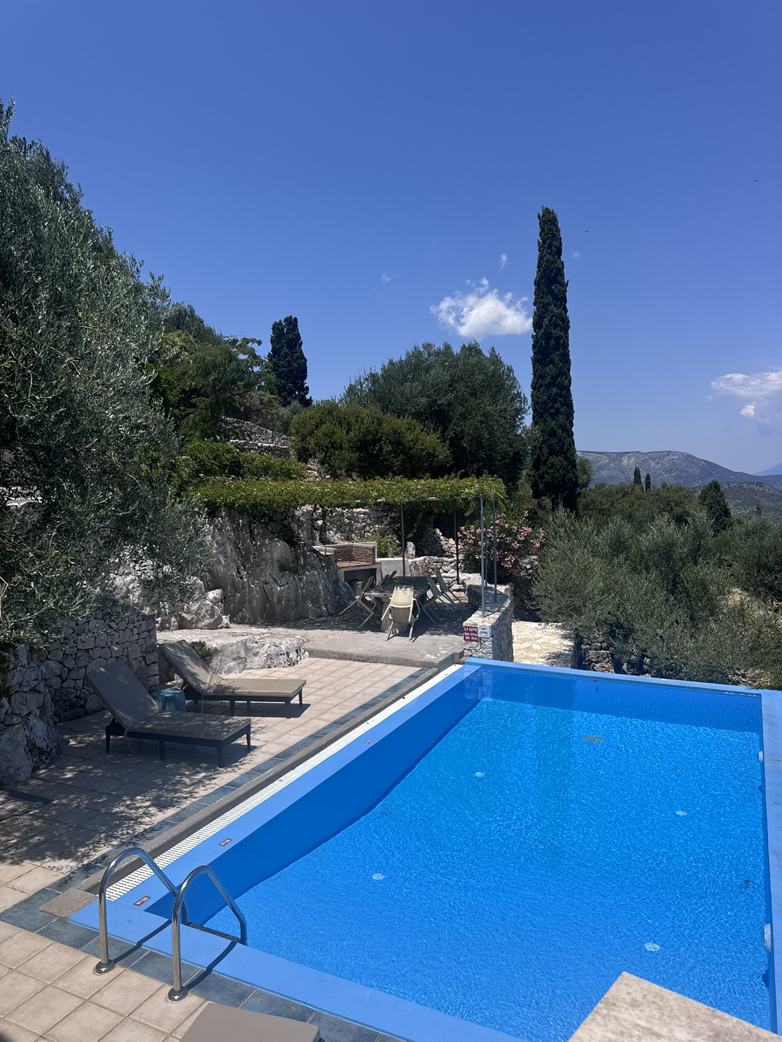 Pool area of house with pool for sale in Ithaca Greece, Perachori