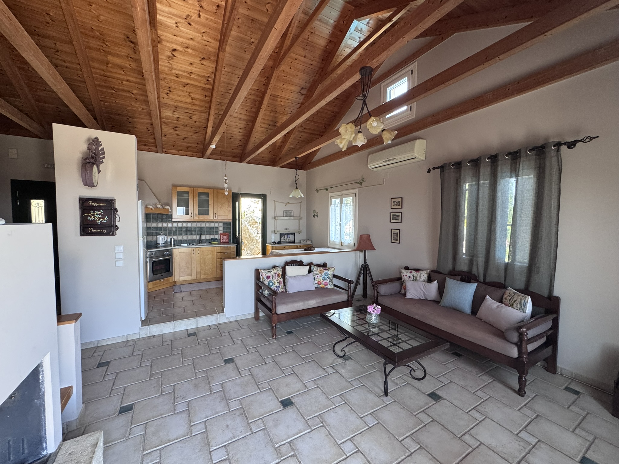 Living and kitchen area of house with pool for sale in Ithaca Greece, Perachori