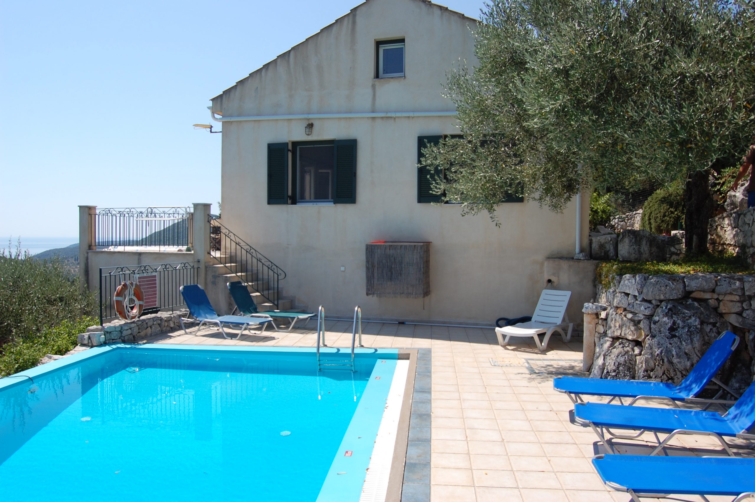 Pool area of house with pool for sale in Ithaca Greece, Perachori